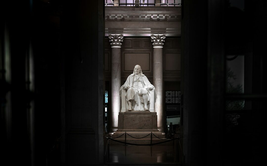 white concrete statue on brown wooden table